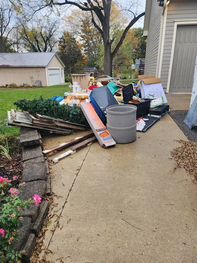 Dumpster being loaded with debris for Estate Cleanout Dumpster Rental in Westchester